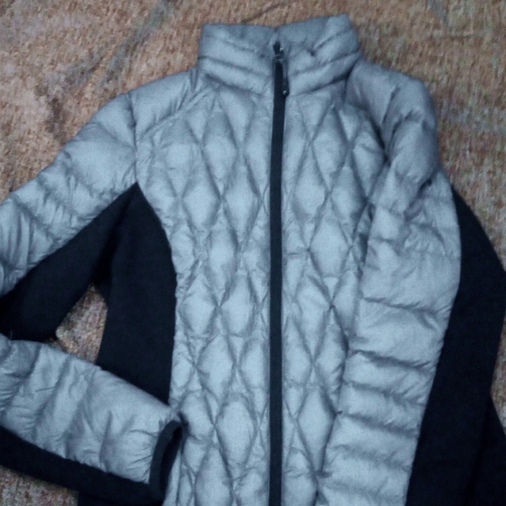 A coat that's water resistant, a grey and black color.